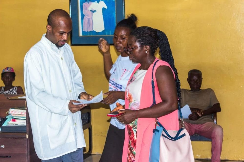 A doctor consulting with women at the centre