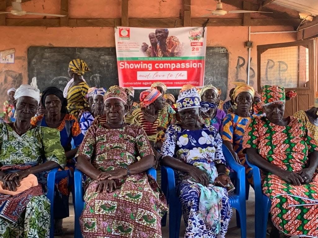 Older women gathered at a community compassion event